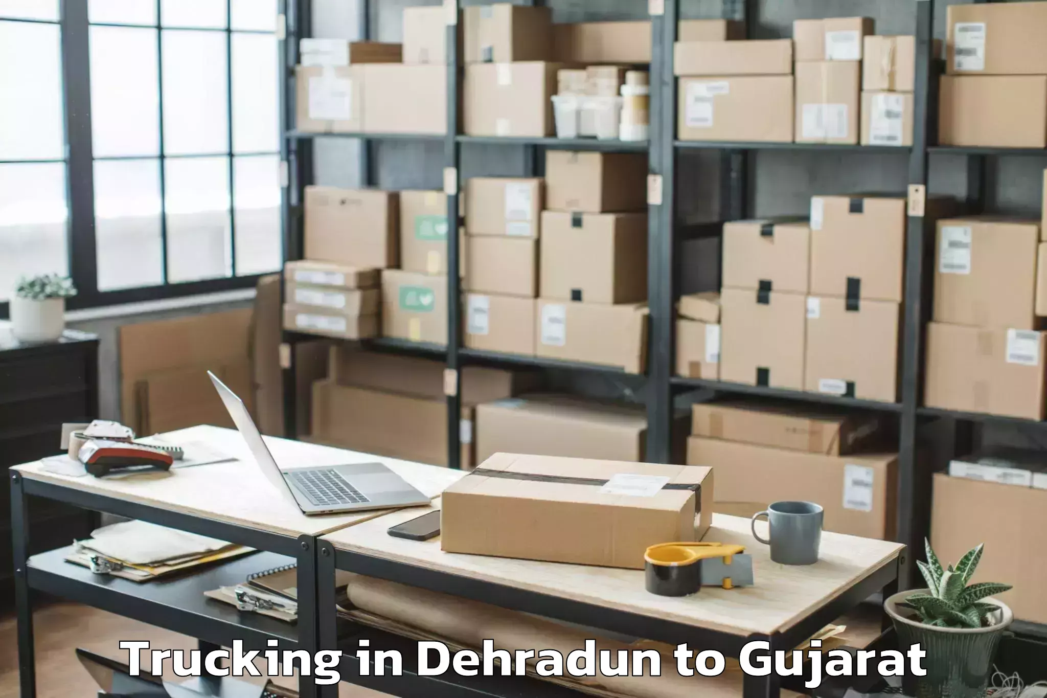 Get Dehradun to Gujarat University Of Transpla Trucking